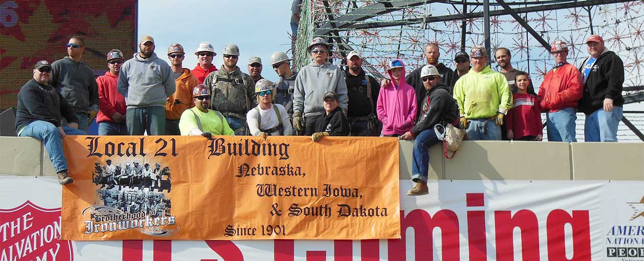 Local 21 with banner at the Tree of Lights